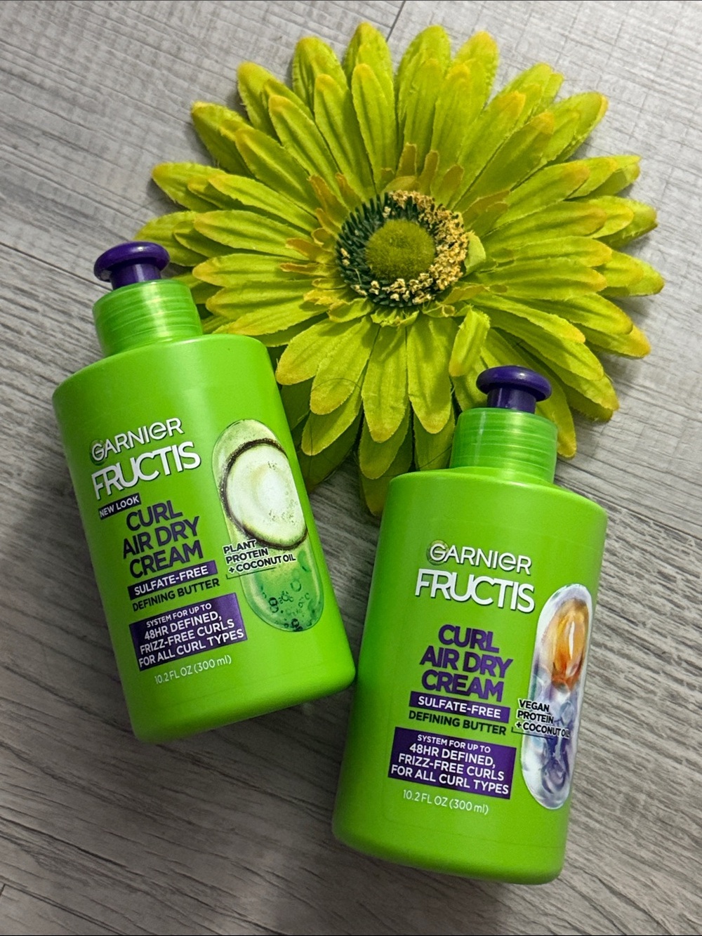 Garnier Fructis Curl Air Dry Cream in Bright Green Bottles with Purple Pumps